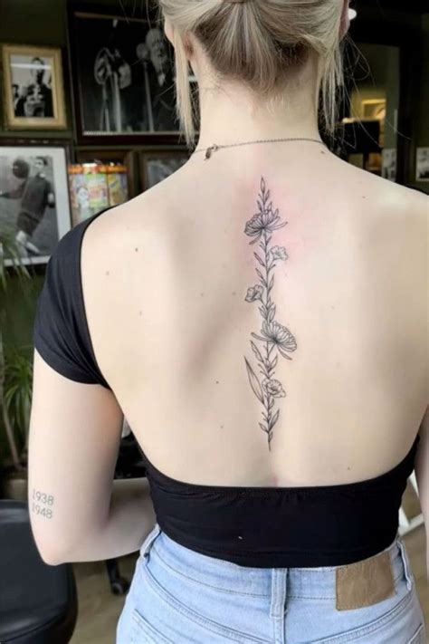 Delicate Flower Spine Tattoo Timeless And Elegant Spine Tattoo Delicate Flower Spine Tattoo Timeless And Elegant Spine Tattoo