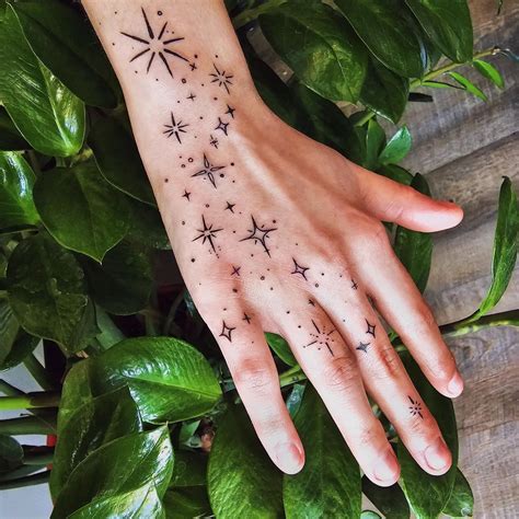 Hand Star Tattoo Designs